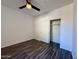 A bedroom features hard surface floors, a ceiling fan, and a sliding door closet at 10136 E Southern Ave # 1110, Mesa, AZ 85209
