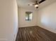 Bright bedroom features modern ceiling fan and wood-look floors at 10136 E Southern Ave # 1110, Mesa, AZ 85209