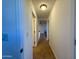 Well-lit hallway featuring tiled floors and neutral wall paint at 10136 E Southern Ave # 1110, Mesa, AZ 85209