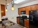 Updated kitchen with granite counters, wood cabinets, stainless steel appliances and pendant lighting at 10136 E Southern Ave # 1110, Mesa, AZ 85209