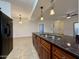 Bright kitchen features granite counters, wood cabinets, stainless steel appliances and pendant lighting at 10136 E Southern Ave # 1110, Mesa, AZ 85209