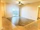 Spacious living room with wood-look floors and sliding glass door at 10136 E Southern Ave # 1110, Mesa, AZ 85209