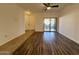 Spacious living area boasts wood-look flooring and glass doors to the outside patio at 10136 E Southern Ave # 1110, Mesa, AZ 85209