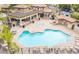 Community pool and spa with lounge chairs and covered seating at 10136 E Southern Ave # 1110, Mesa, AZ 85209