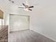 Simple bedroom with ceiling fan and large closet at 10359 W Sunflower Pl, Avondale, AZ 85392