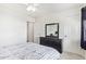 Bedroom with queen bed, dresser, and closet at 10359 W Sunflower Pl, Avondale, AZ 85392