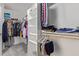 Walk-in closet with shelving and hanging rods at 10359 W Sunflower Pl, Avondale, AZ 85392