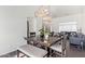 Bright dining area features a square table and bench seating at 10359 W Sunflower Pl, Avondale, AZ 85392