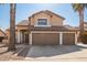 Two-story house with three-car garage and desert landscaping at 10359 W Sunflower Pl, Avondale, AZ 85392