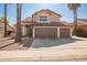 Two-story house with three-car garage and desert landscaping at 10359 W Sunflower Pl, Avondale, AZ 85392