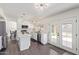 Modern kitchen with white cabinets, island, and stainless steel appliances at 10359 W Sunflower Pl, Avondale, AZ 85392