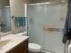 Clean bathroom with a sliding glass shower door at 10604 W Camelot Cir, Sun City, AZ 85351