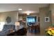 Open dining area with view into the living room and kitchen at 10604 W Camelot Cir, Sun City, AZ 85351