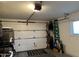 Attached garage with golf cart and storage at 10604 W Camelot Cir, Sun City, AZ 85351