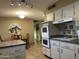 Updated kitchen boasts double ovens and ample storage at 10604 W Camelot Cir, Sun City, AZ 85351