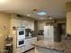 Spacious kitchen with double wall oven and island at 10604 W Camelot Cir, Sun City, AZ 85351