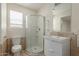 Updated bathroom with a walk-in shower, toilet and vanity at 1122 W Dragoon Ave, Mesa, AZ 85210