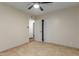 Bedroom with tile floors, ceiling fan and closet at 1122 W Dragoon Ave, Mesa, AZ 85210