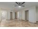 Spacious bedroom with tile flooring, ceiling fan, and multiple closets at 1122 W Dragoon Ave, Mesa, AZ 85210