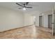 Well-lit bedroom featuring tile floors and a ceiling fan at 1122 W Dragoon Ave, Mesa, AZ 85210