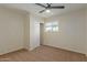 Spacious bedroom with carpet, ceiling fan and closet at 1122 W Dragoon Ave, Mesa, AZ 85210