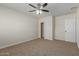 Bedroom with carpet, ceiling fan and exposed brick wall at 1122 W Dragoon Ave, Mesa, AZ 85210