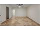 Bright bedroom with tile flooring and ceiling fan at 1122 W Dragoon Ave, Mesa, AZ 85210