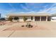 Ranch style home with two-car garage and landscaped front yard at 1122 W Dragoon Ave, Mesa, AZ 85210