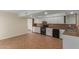 Modern kitchen with white cabinets and tile flooring at 1122 W Dragoon Ave, Mesa, AZ 85210