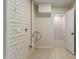 Functional laundry room with tile floors and plumbing access at 1122 W Dragoon Ave, Mesa, AZ 85210