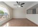 Living room with tiled floor and ceiling fan at 1122 W Dragoon Ave, Mesa, AZ 85210