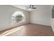 Living room with arch window and tiled floor at 1122 W Dragoon Ave, Mesa, AZ 85210