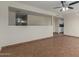 Bright living room with tile floors and kitchen view at 1122 W Dragoon Ave, Mesa, AZ 85210