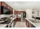 Kitchen with stainless steel appliances and wood cabinets at 11695 N 166Th Ln, Surprise, AZ 85388