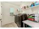 Laundry room with washer, dryer, and shelving for storage at 11695 N 166Th Ln, Surprise, AZ 85388