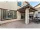 Covered patio with pavers and sliding glass doors at 11695 N 166Th Ln, Surprise, AZ 85388