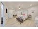 Bright bedroom with a four-poster bed, mirrored closet, and light wood floors at 11776 N 119Th St, Scottsdale, AZ 85259