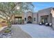 Stunning desert home exterior with landscaped courtyard and paver driveway at 11776 N 119Th St, Scottsdale, AZ 85259