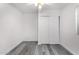 Simple bedroom with gray vinyl flooring and closet at 1208 E Hess Ave, Phoenix, AZ 85034