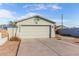 Attached two-car garage with a driveway at 1208 E Hess Ave, Phoenix, AZ 85034