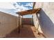 Side yard with covered structure and gate at 1208 E Hess Ave, Phoenix, AZ 85034