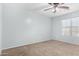 Bright bedroom with ceiling fan and neutral walls at 12113 W Planada Ln, Peoria, AZ 85383