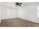 Well-lit bedroom featuring a ceiling fan at 12113 W Planada Ln, Sun City, AZ 85373