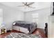 Bedroom with ceiling fan, wood floors and rug at 12113 W Planada Ln, Peoria, AZ 85383