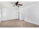 Bedroom with ceiling fan and neutral decor at 12113 W Planada Ln, Sun City, AZ 85373