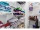 Linen closet with shelving; neatly organized at 12113 W Planada Ln, Sun City, AZ 85373