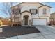 Two-story house with a large garage and landscaped front yard at 12113 W Planada Ln, Peoria, AZ 85383