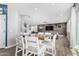 Kitchen with white cabinets, wooden island, and view into the living room at 12113 W Planada Ln, Sun City, AZ 85373