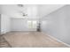 Bright living room with carpet and ceiling fan at 12113 W Planada Ln, Sun City, AZ 85373