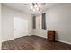 Bright bedroom with dark flooring and ceiling fan at 12759 W Eagle Ridge Ln, Peoria, AZ 85383